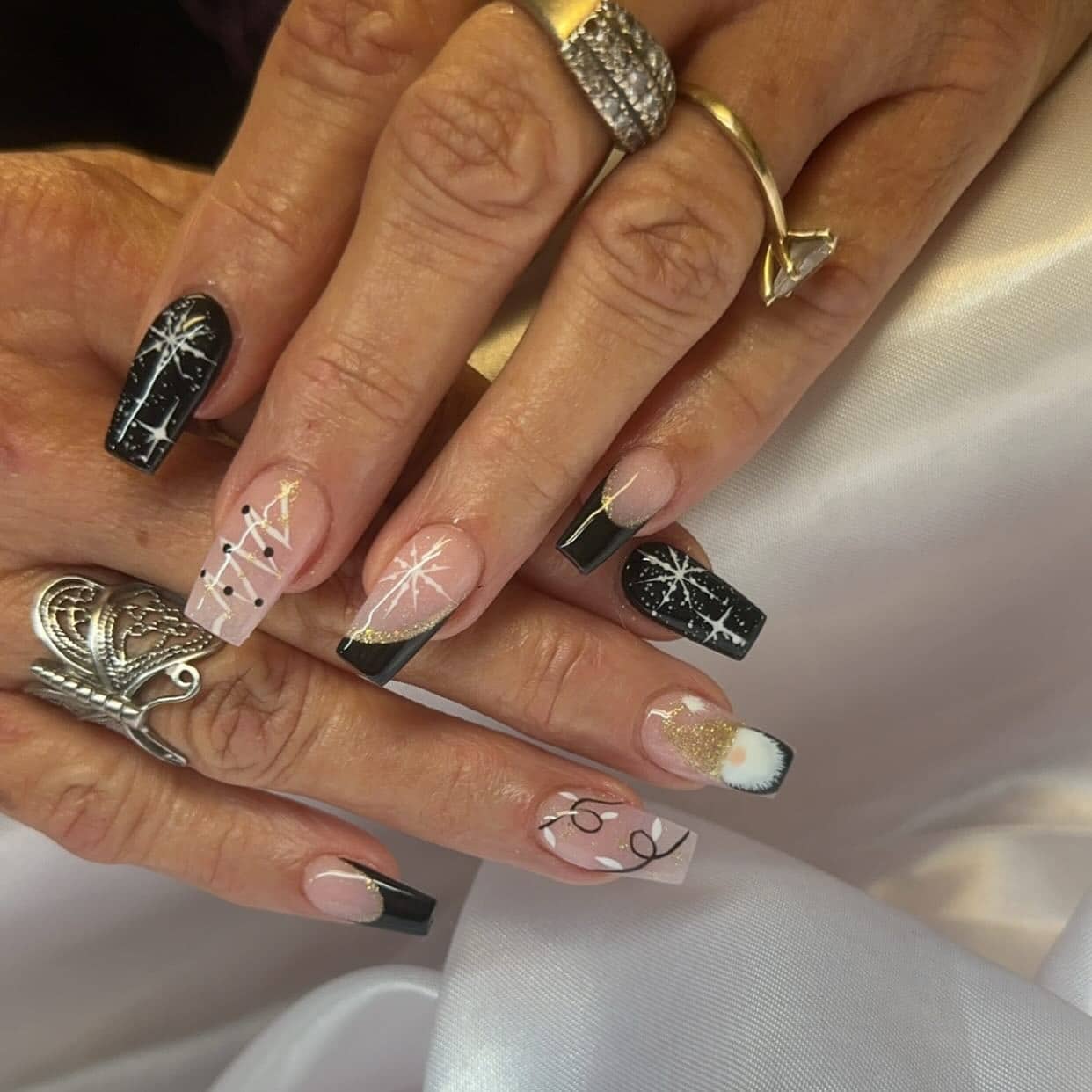 13. Black and Nude Nails with Gold Starburst Art - black, white and gold nail ideas