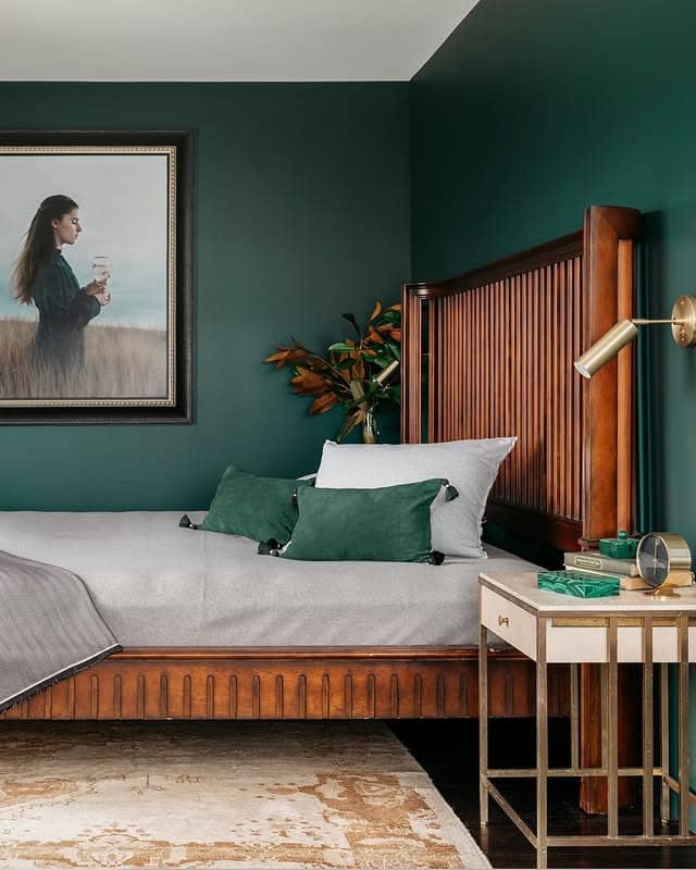 1. Dark Green Elegance with Warm Wood Accents - dark green bedroom ideas