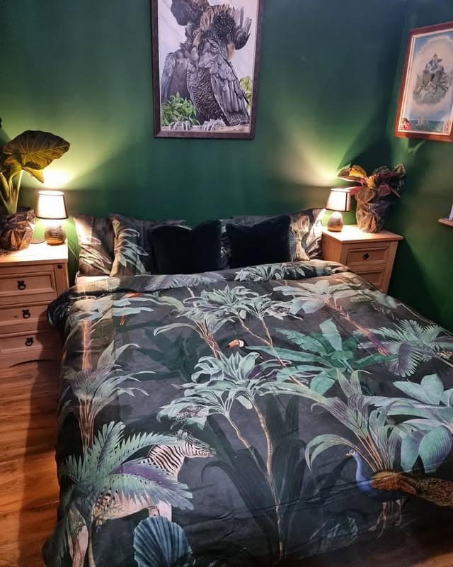 7. Deep Green Bedroom with Nature-Inspired Textiles - dark green bedroom ideas