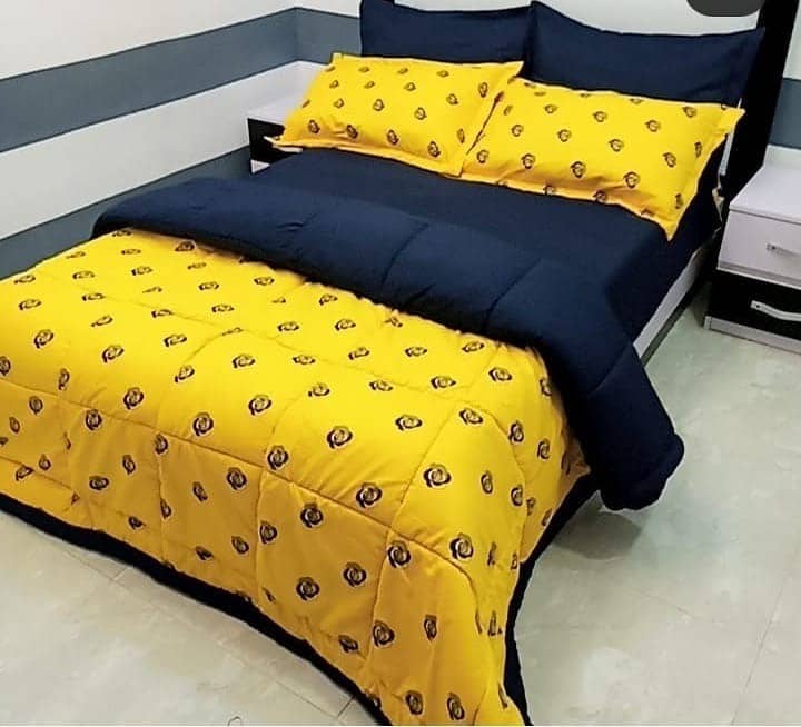 12. Bold Yellow and Navy Bedding Statement - yellow and blue bedroom ideas