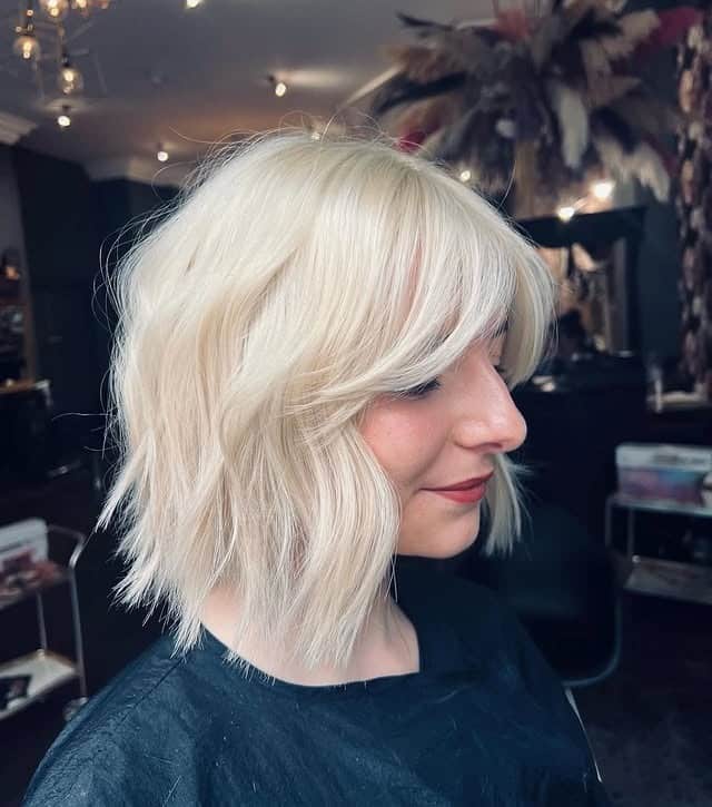 5. Textured Wavy Bob with Long Bangs in Platinum Blonde - Bob Hairstyles with Bangs