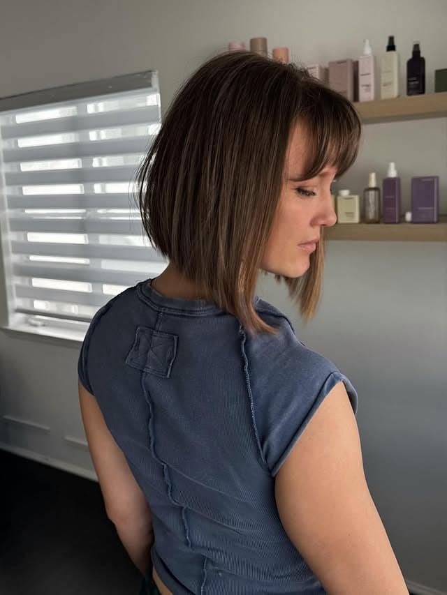 7. Stacked Bob with Side Bangs in Cool Brunette - Bob Hairstyles with Bangs