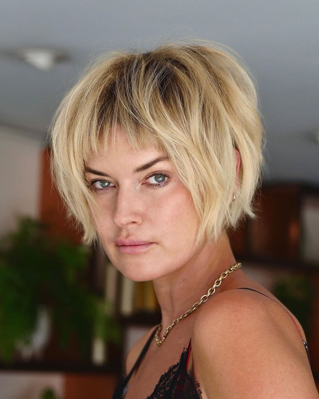 8. Short Choppy Bob with Cropped Bangs in Soft Blonde - Bob Hairstyles with Bangs