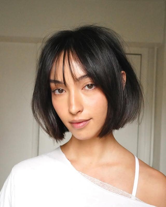 11. Soft Jaw-Length Bob with Wispy Bangs in Natural Black - Bob Hairstyles with Bangs
