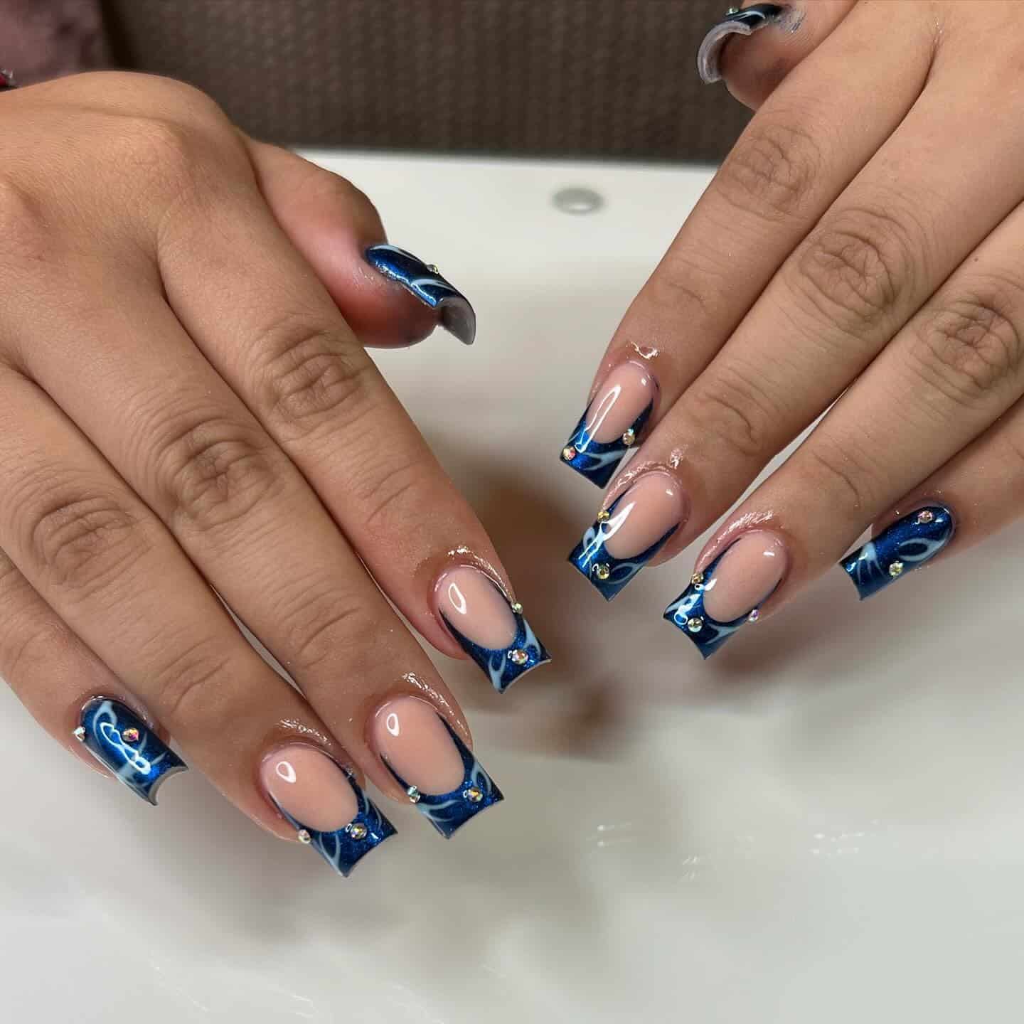 2. Midnight Blue Swirl French with Crystal Details - blue tip nail ideas
