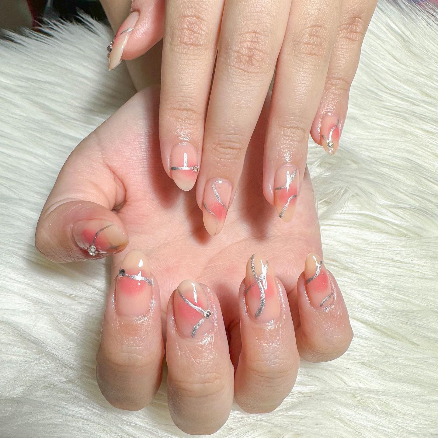 6. Soft Coral Blush with Silver Ribbon Art - blush nail ideas