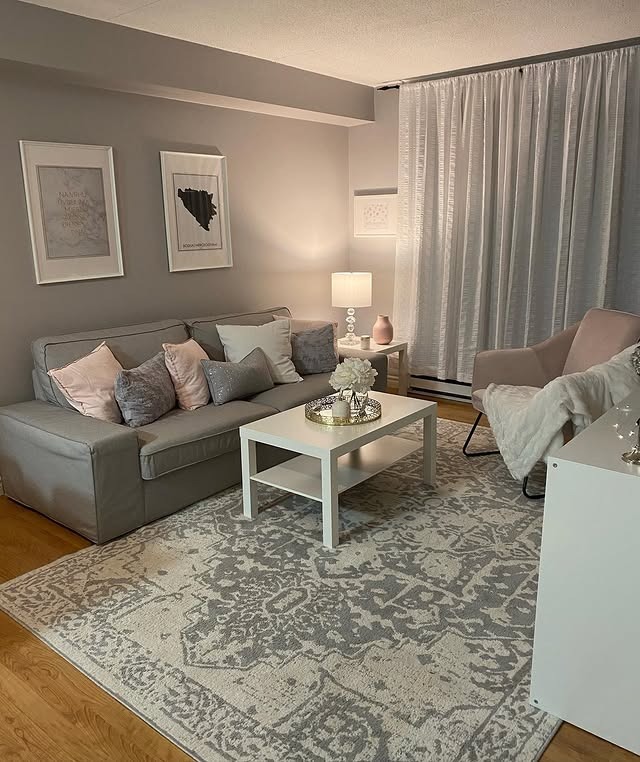 2. Warm Grey Sofa with Dusty Pink Styling - grey and pink living room ideas