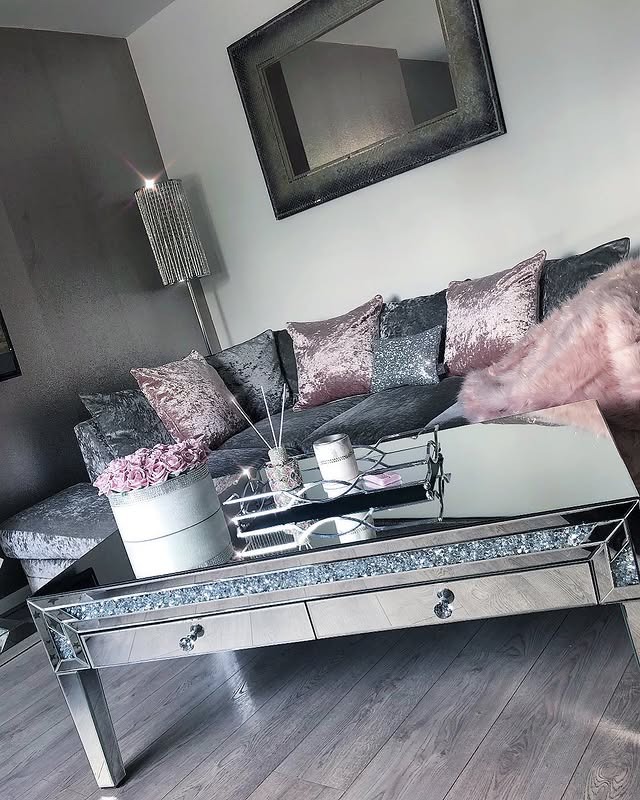 6. Moody Grey Lounge with Blush Metallic Highlights - grey and pink living room ideas