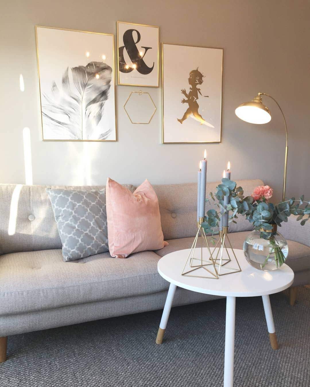 22. Scandinavian Grey Sofa with Blush and Gold Styling - grey and pink living room ideas