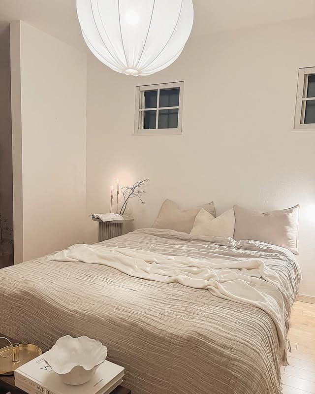 1. Soft Ivory Scandinavian Bedroom with Layered Neutrals - scandinavian bedroom ideas