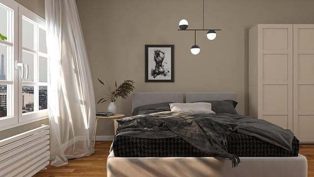 7. Taupe and Grey Nordic Bedroom with Contemporary Edge - scandinavian bedroom ideas