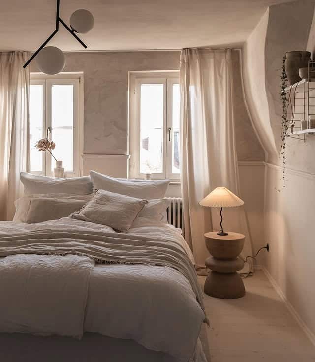 11. Soft Greige Scandinavian Bedroom with Sculptural Lighting - scandinavian bedroom ideas