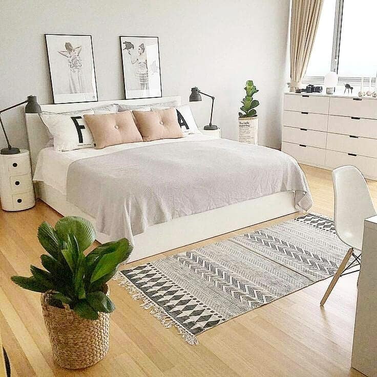 12. Crisp White Scandinavian Bedroom with Blush Accents - scandinavian bedroom ideas