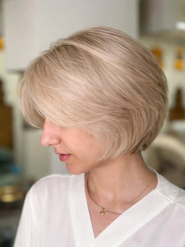 22. Creamy Platinum Blonde French Bob with Feathered Layers - French Bob Hair