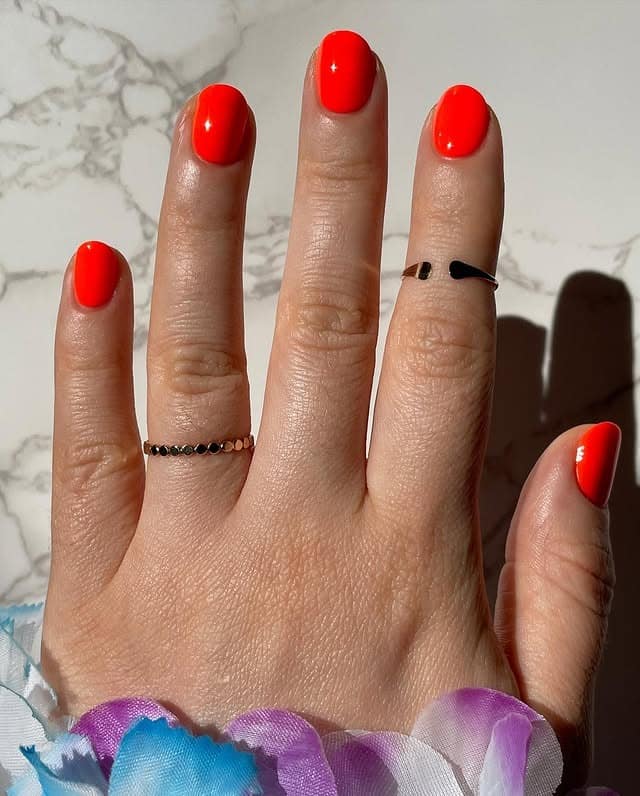 6. Short Round Nails in Bold Neon Orange - bright orange nail ideas