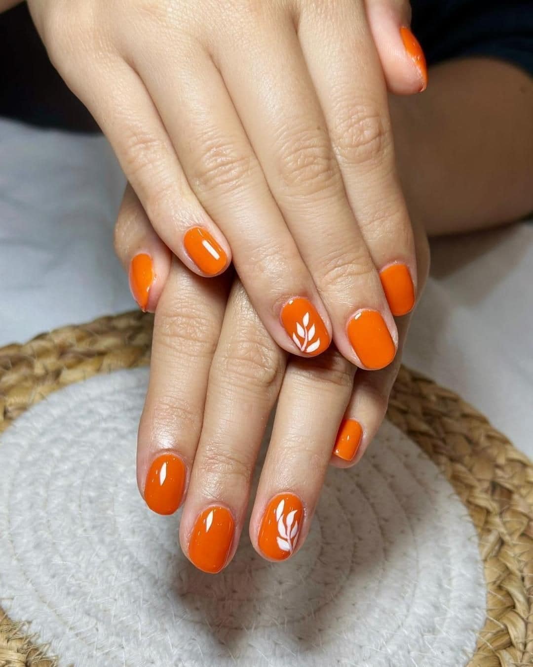 10. Leaf Accent Short Round Nails in Bright Orange - bright orange nail ideas