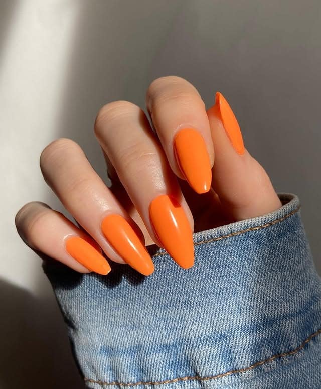20. Glossy Almond Nails in Bold Tangerine Orange - bright orange nail ideas