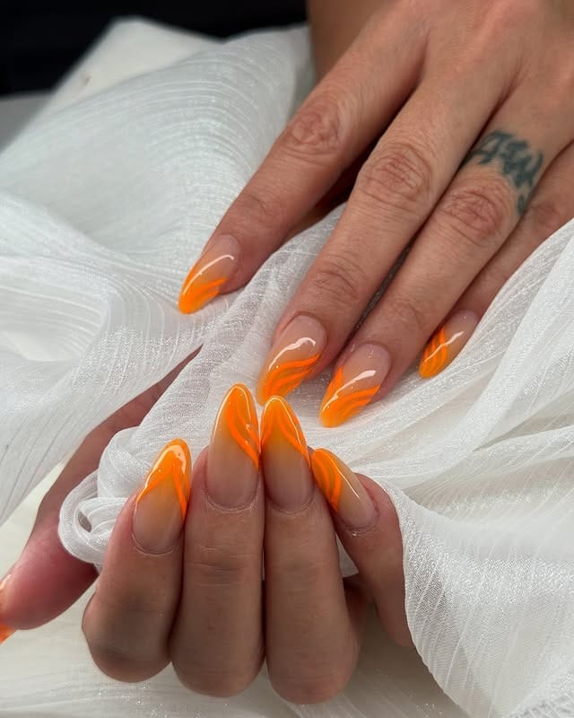 21. Abstract French Almond Nails in Neon Orange - bright orange nail ideas