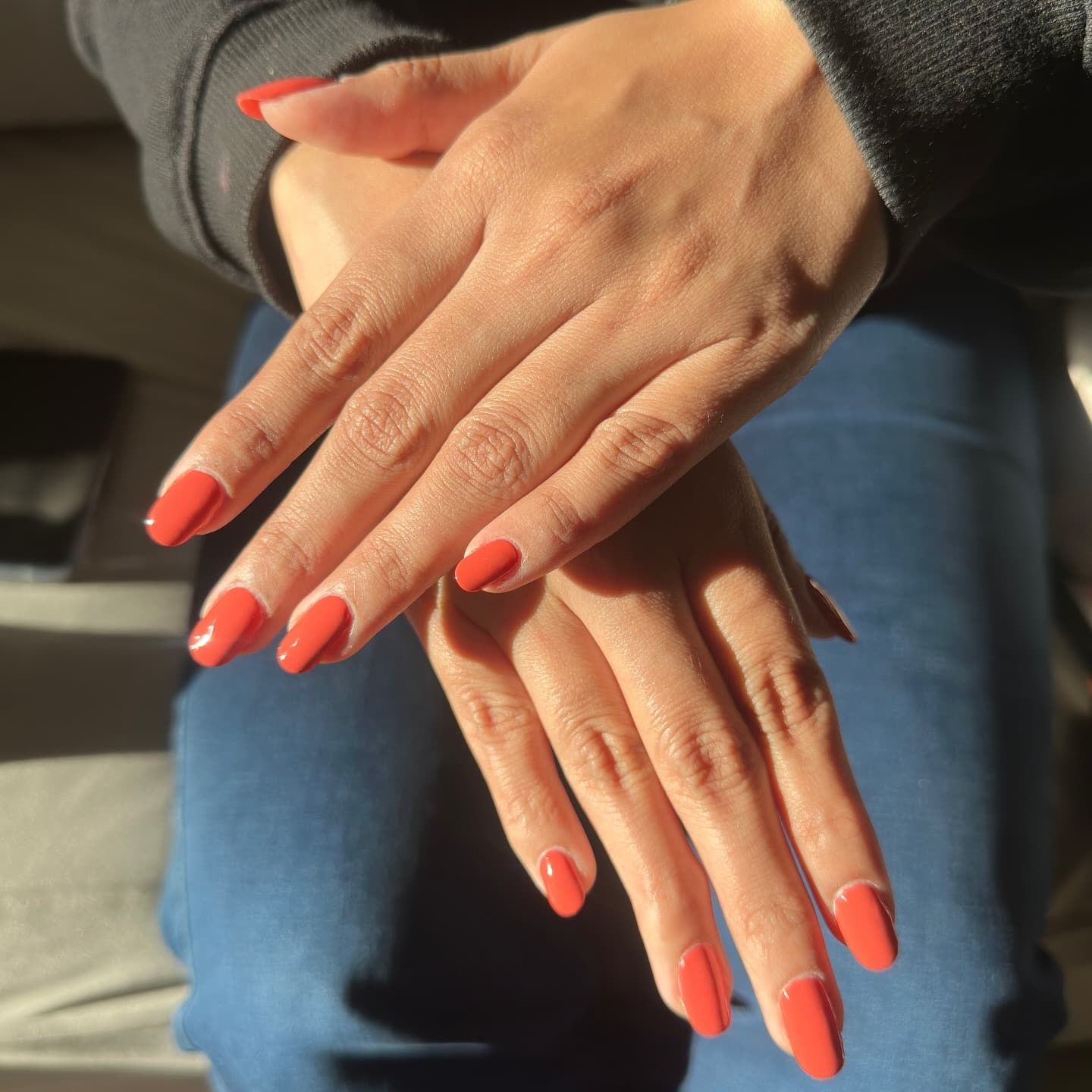 22. Glossy Short Oval Nails in Coral Bright Orange - bright orange nail ideas
