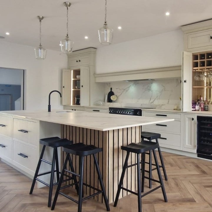 2. Soft Cream Kitchen with Statement Marble Veining - classic kitchen ideas