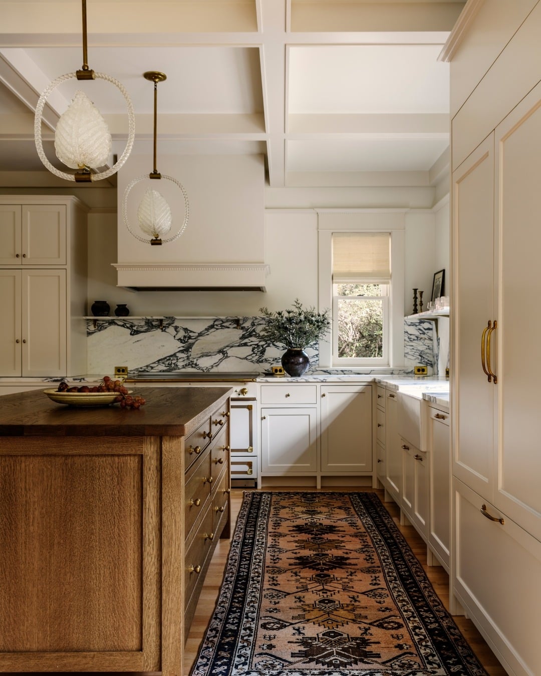 5. Traditional Cream Kitchen with Ornate Lighting Details - classic kitchen ideas