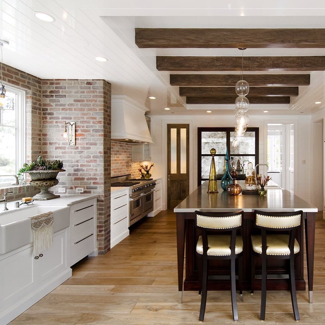 6. Rustic Brick Accent Kitchen with Exposed Wood Beams - classic kitchen ideas