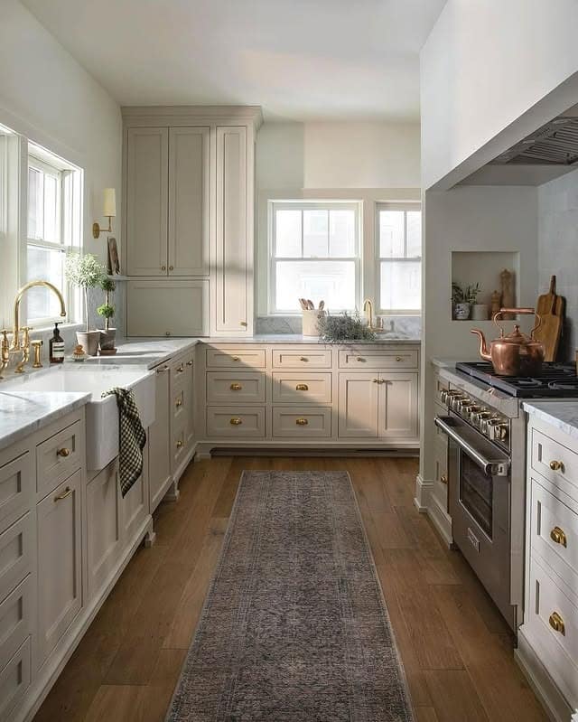 18. Soft Greige Kitchen with Brass Accents and Farmhouse Sink - classic kitchen ideas