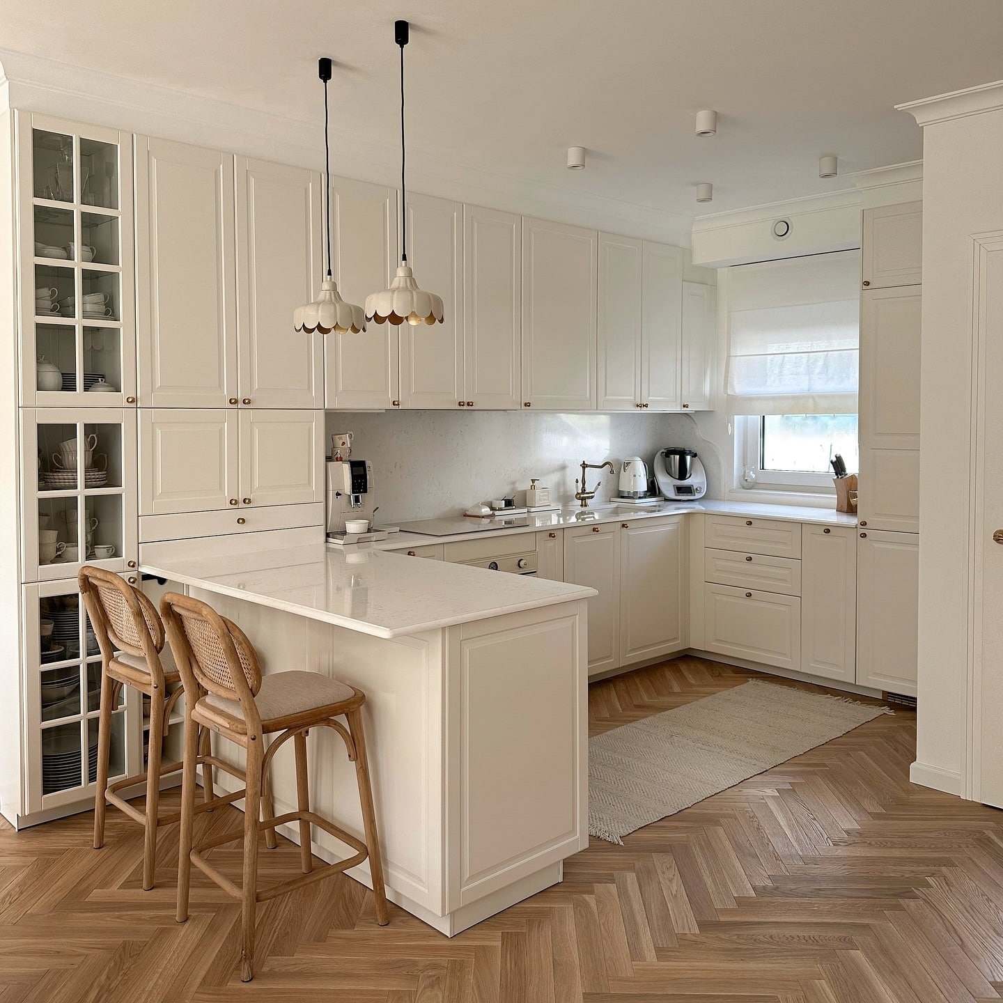 20. Cream Shaker Kitchen with Herringbone Wood Flooring - classic kitchen ideas