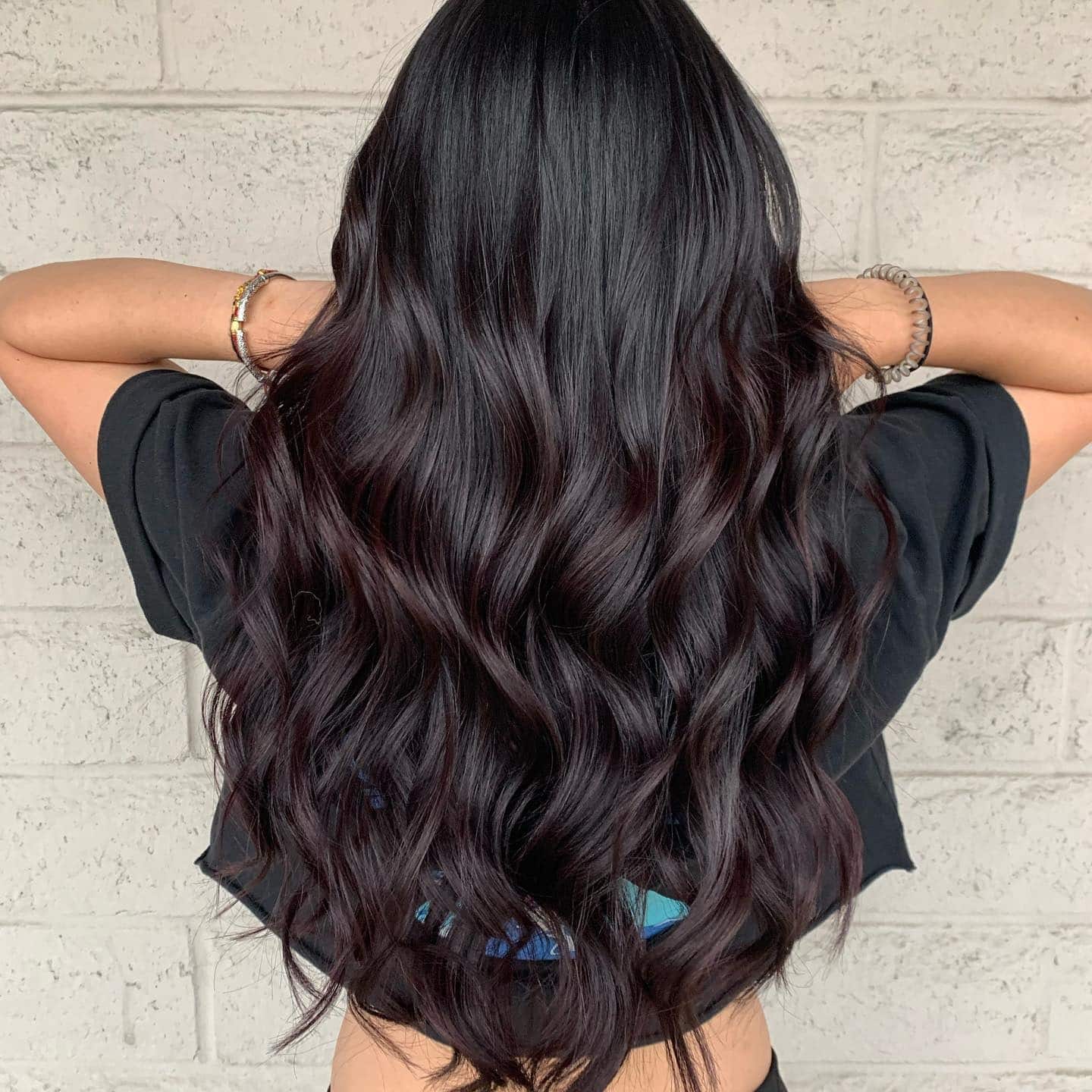 19. Long Layered Waves with Subtle Burgundy Tint - Dark Burgundy Hair Color