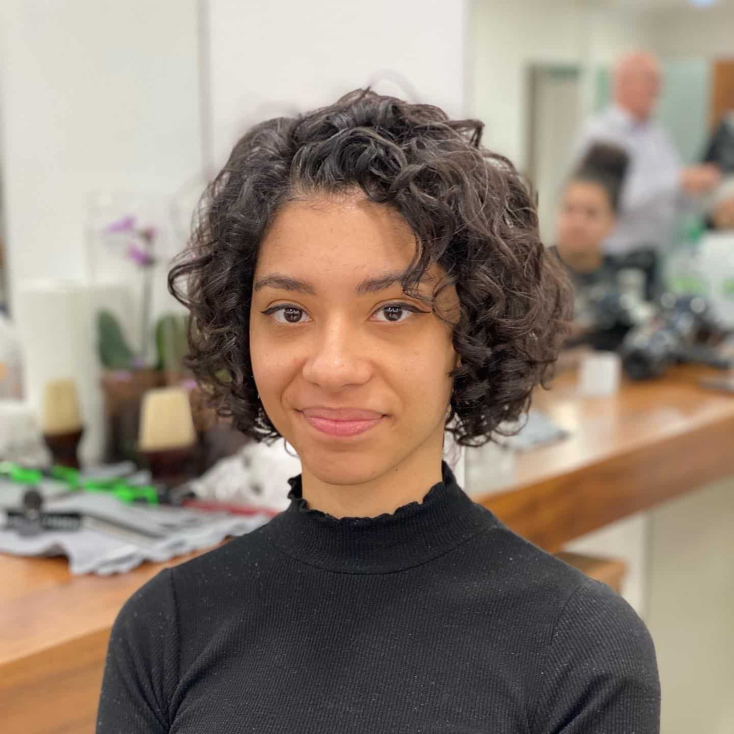 1. Soft Curly Bob in Natural Dark Brunette - Short Curly Hairstyles