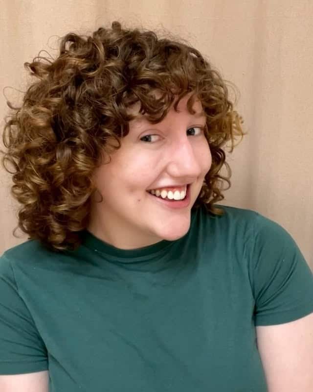 2. Rounded Curly Bob in Warm Chestnut Brown - Short Curly Hairstyles