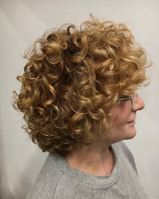 7. Voluminous Curly Bob in Honey Blonde - Short Curly Hairstyles