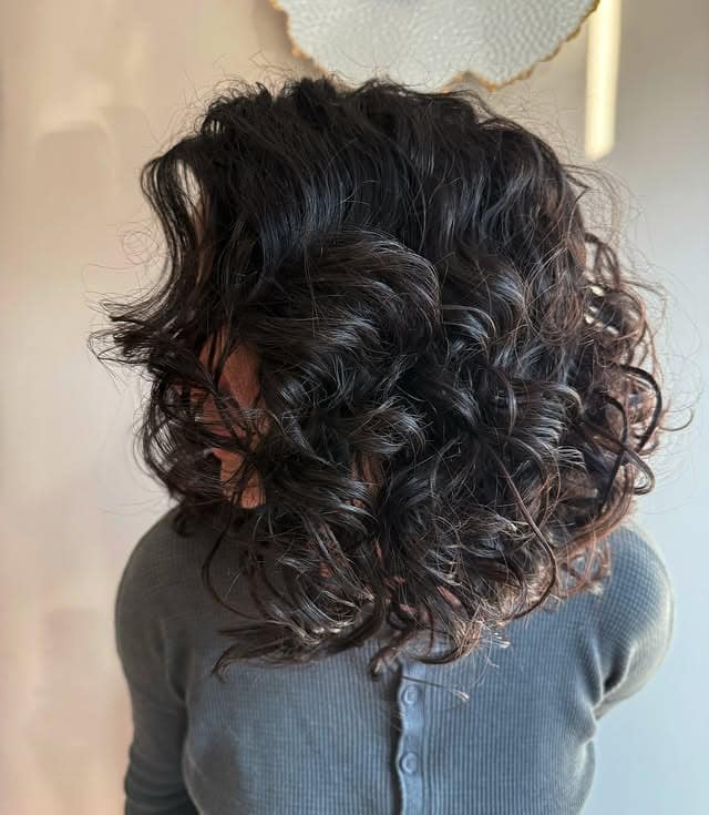 13. Rounded Curly Bob in Deep Espresso Brown - Short Curly Hairstyles