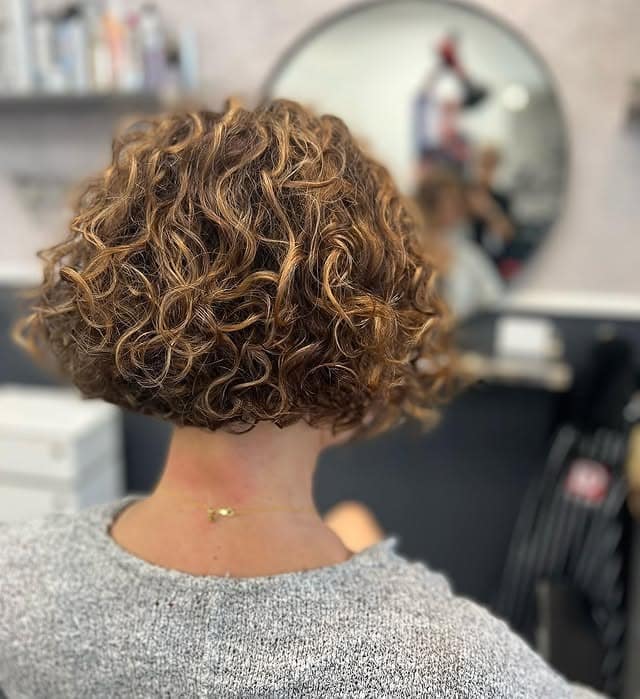 17. Sculpted Curly Bob in Golden Brown - Short Curly Hairstyles