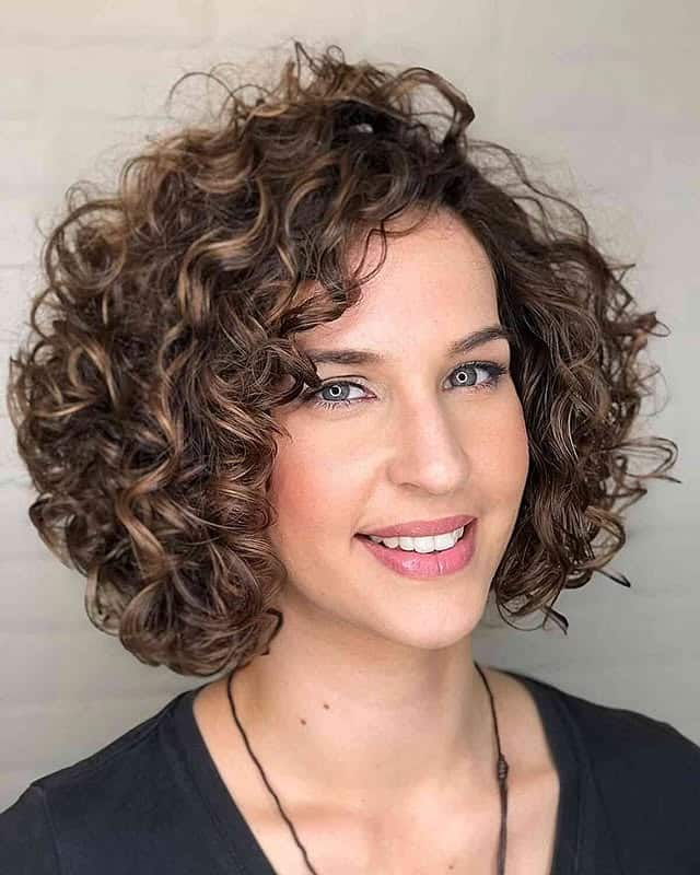 22. Layered Curly Bob in Chestnut Brown with Subtle Highlights - Short Curly Hairstyles