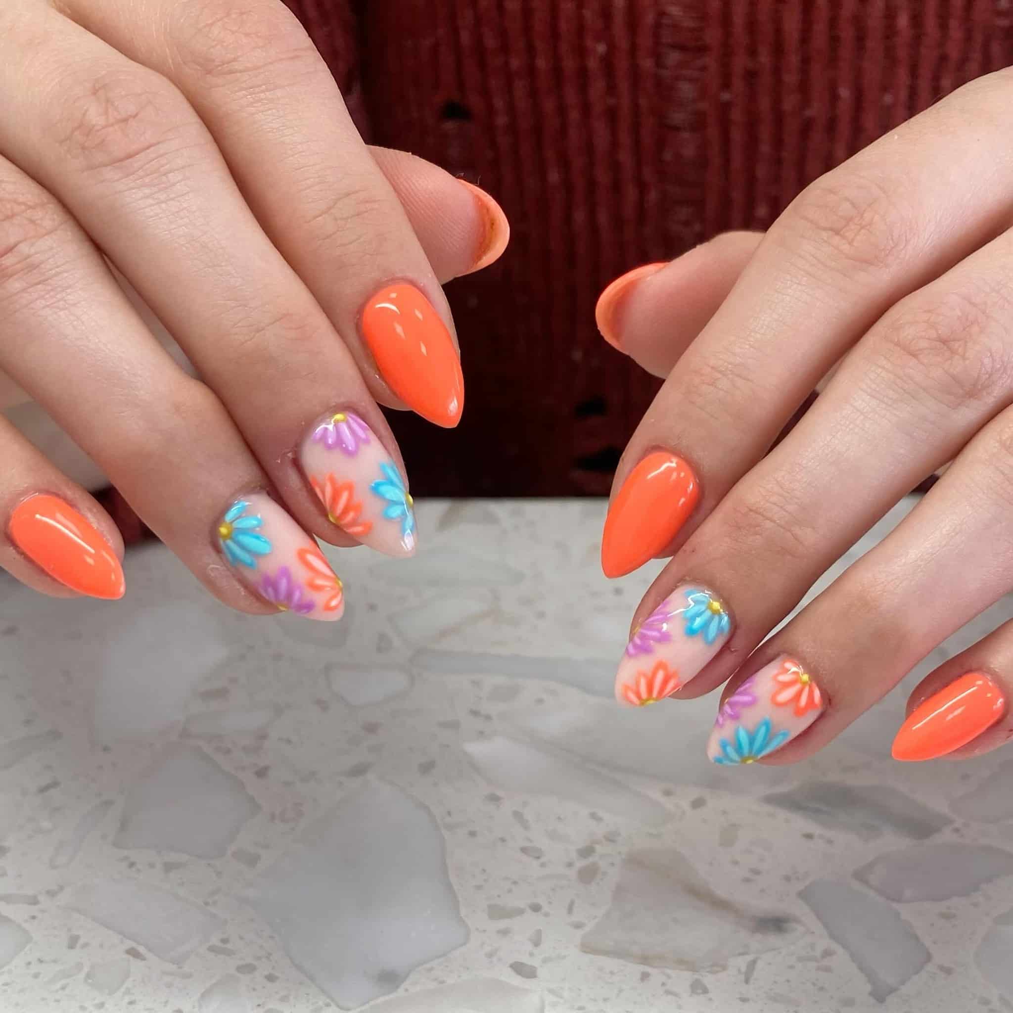 1. Neon Coral Almond with Pastel Daisy Accent - bright spring nail ideas
