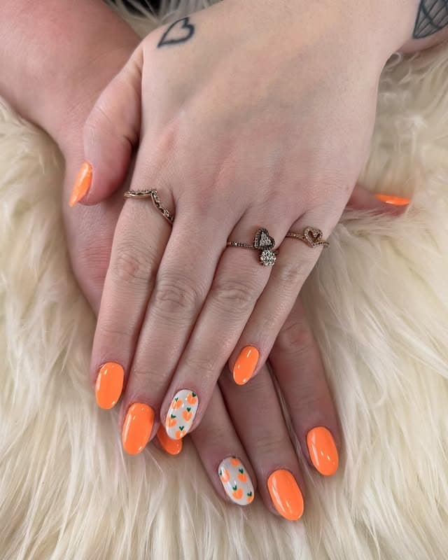 12. Neon Orange Almond with Mini Carrot Accent - bright spring nail ideas