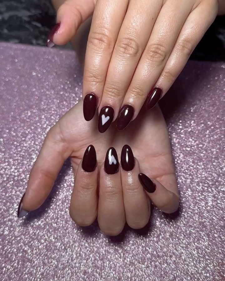 2. Deep Mocha Almond Nails with White Heart Accent - brown almond nail ideas