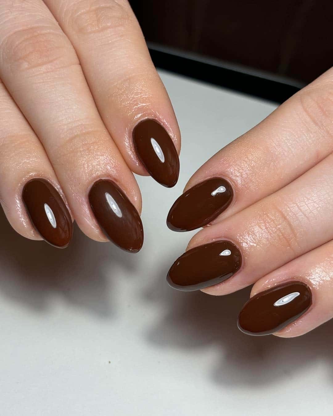21. Glossy Cocoa Almond Nails - brown almond nail ideas