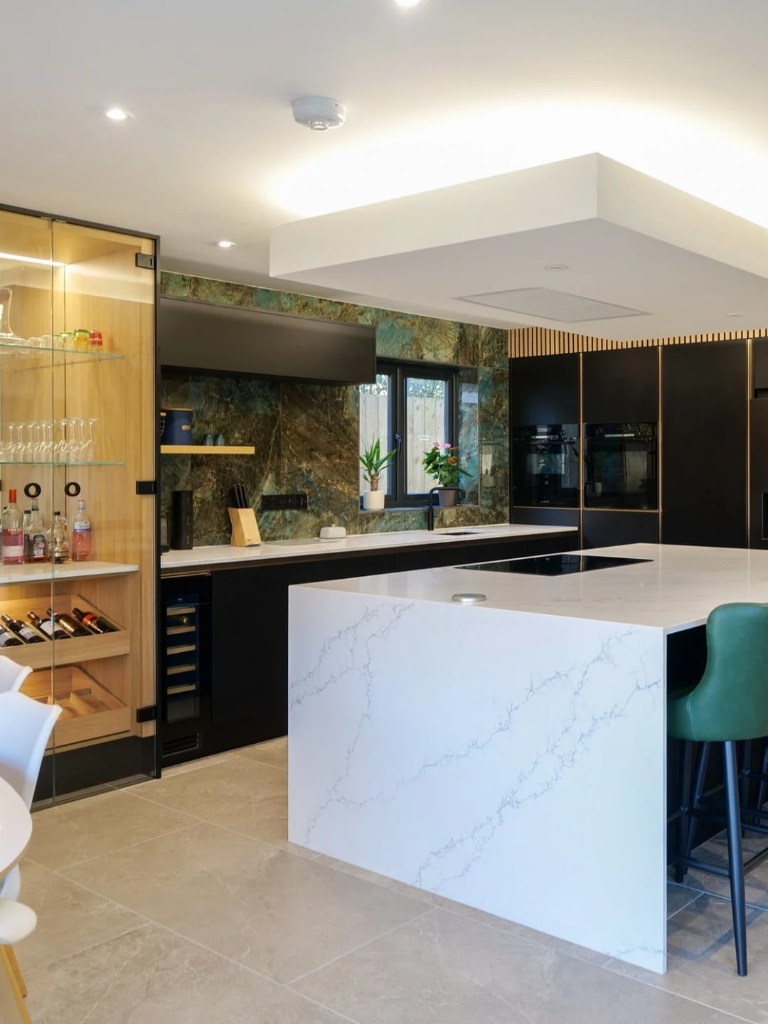 6. Black and Marble Luxe Kitchen with Glass Display Cabinet - unique kitchen ideas