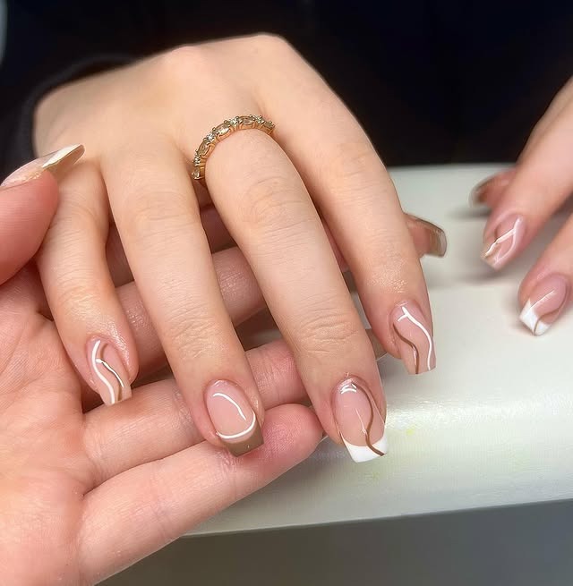 19. Minimalist Mocha Swirl French - brown and white nail ideas
