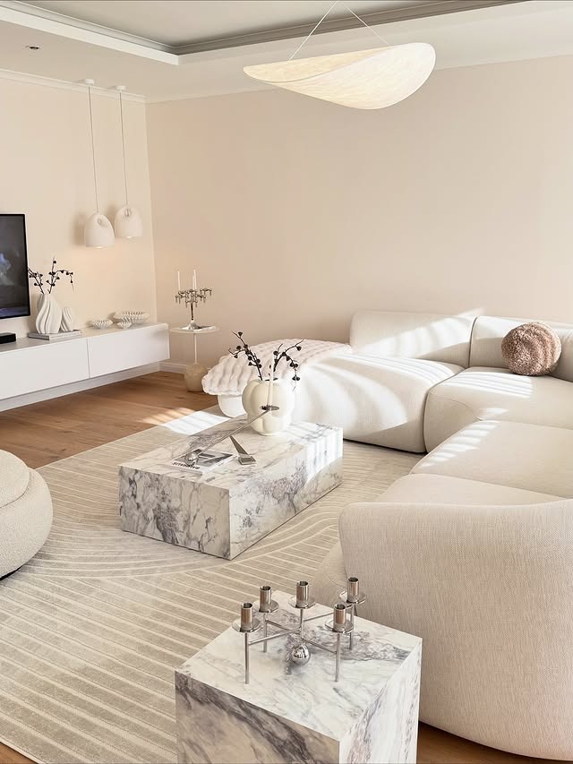 1. Sculpted Marble & Soft Beige Harmony - white living room ideas