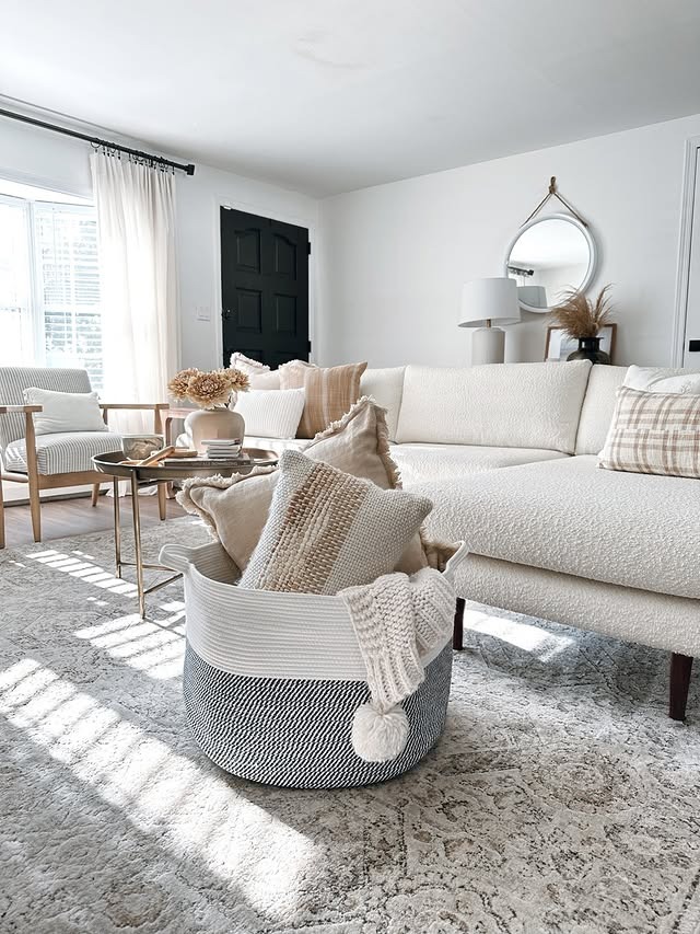 3. Cozy White Layers with Charcoal Contrast - white living room ideas