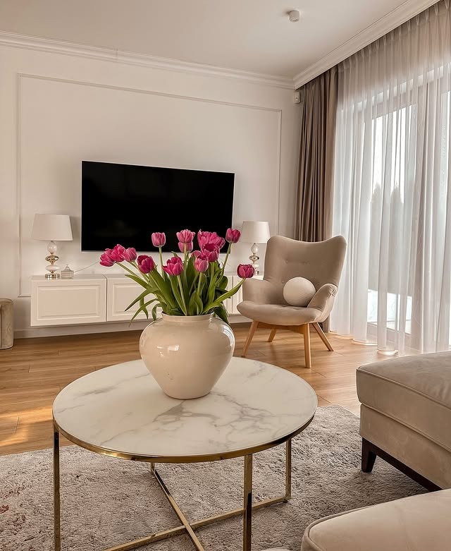 10. Elegant White with Subtle Gold & Floral Touches - white living room ideas
