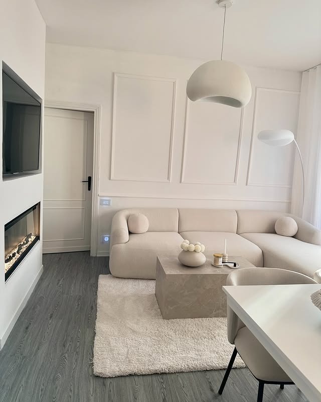 11. Creamy Minimalist White with Soft Gray Flooring - white living room ideas