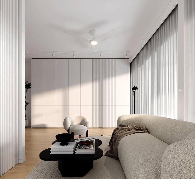 16. Modern White with Sculptural Black Contrast - white living room ideas