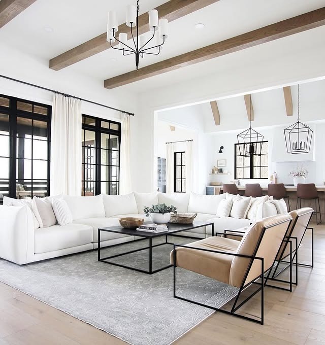 17. White Farmhouse with Black Iron Details - white living room ideas