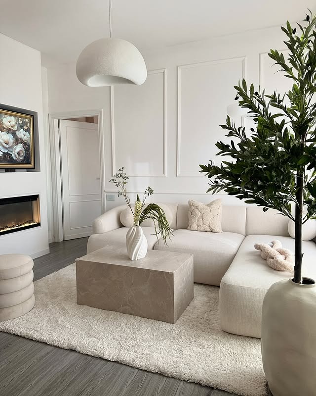 21. Soft White with Marble Block and Olive Green Accents - white living room ideas