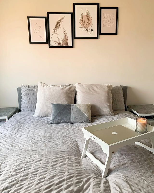 10. Neutral Gallery Wall with Soft Textiles - spare bedroom ideas