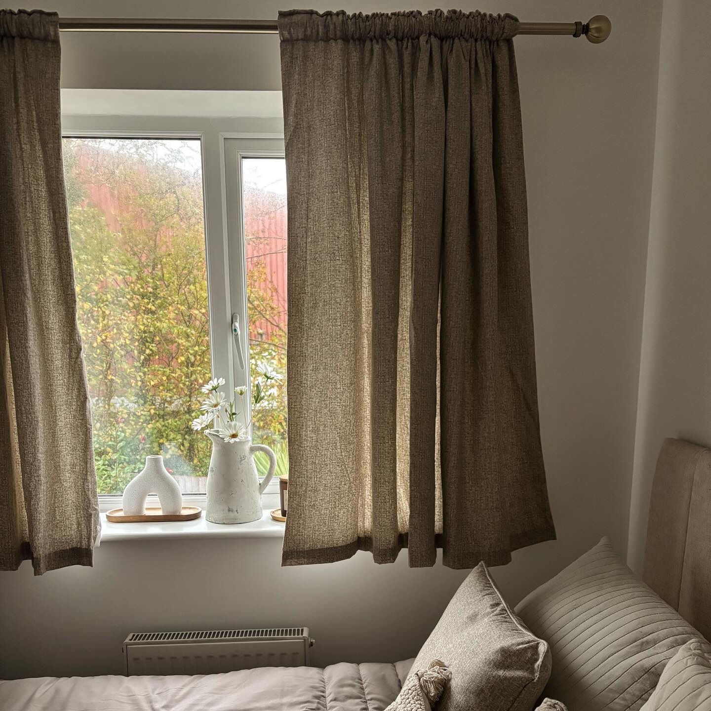 20. Warm Linen Curtains and Organic Accents - spare bedroom ideas